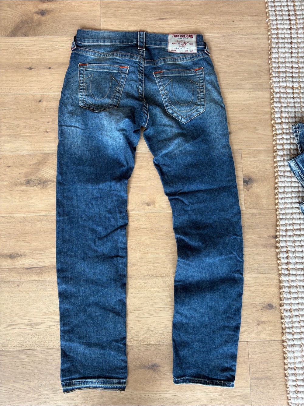 Men’s distressed True Religion jeans